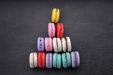 delicious French dessert macarons on a black background