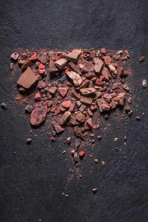 Make up crushed rouge on black background