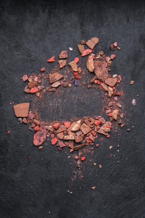 Make up crushed rouge on black backgroundの写真素材