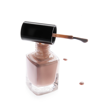 Elegant bottle with nail polish, trendy color, with a stroke, on a white backgroundの写真素材