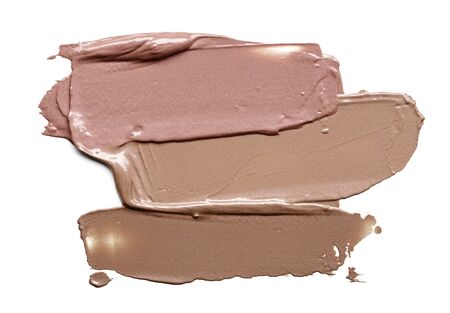 Collection of smear crushed cosmetic products on a white backgroundの写真素材