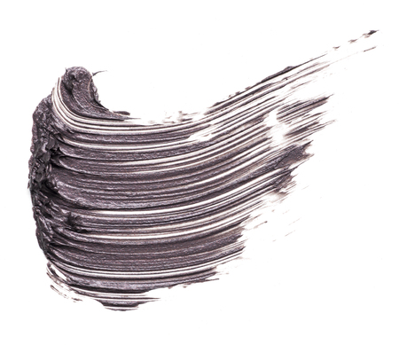 cosmetic products smear paint of mascara on a white backgroundの写真素材