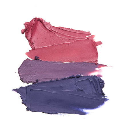 Collection of pink smear crushed cosmetic products on a white backgroundの写真素材