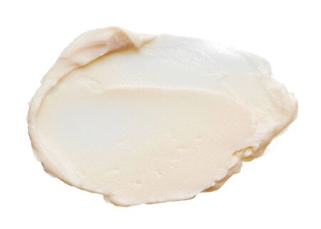 Gently beige strokes and texture of makeup foundation or acrylic paint isolated on white backgroundの写真素材