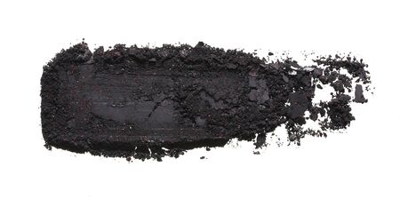 Texture of broken black eyeshadow or powder. Macro texture of broken black powder, backgroundの写真素材