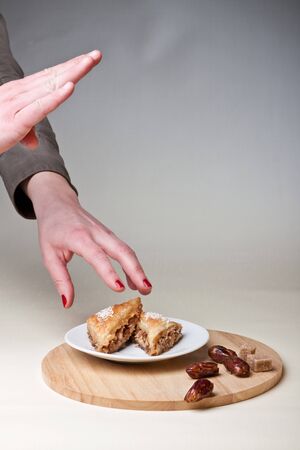 two hands taking cakeの写真素材