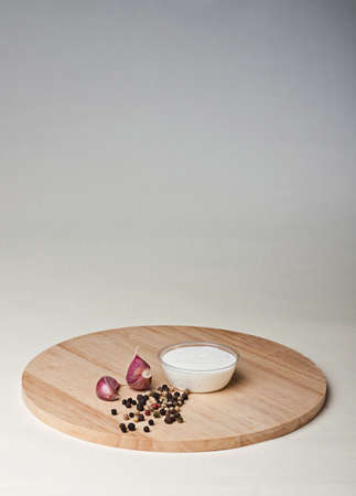 white garlic gravy on a wooden boardの写真素材