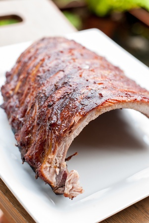 grilled pork ribson a  white dish