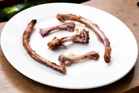 Bone of Grilled pork ribs on white dishの写真素材