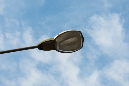Old street lamp - lantern and blue sky with lighthouse