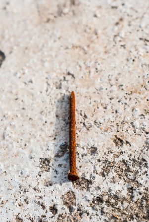 Rusty nails on the concreteの写真素材