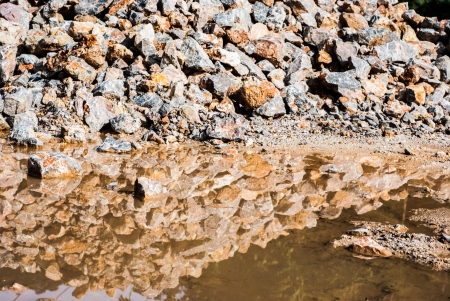 pile of rocks  for construction  and Reflection in the waterの写真素材