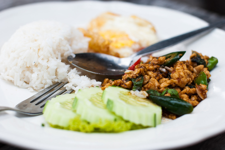 Thai spicy food, stir fried chicken whit basil on rice の写真素材