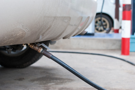 A car refuel the cheap LPG at gas stationの写真素材