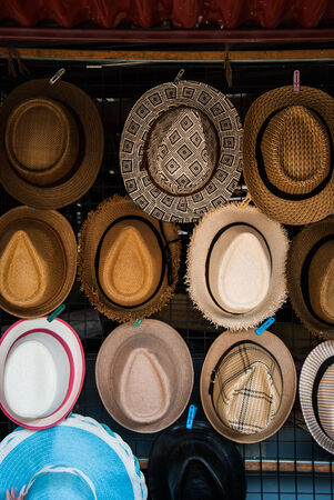 Hats are stacked for sale at the outdoorの写真素材