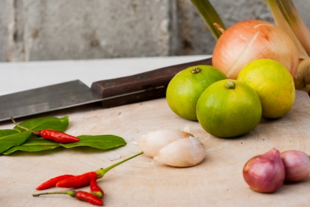 Herbs and spices set to make Tom Yum spicy soup on the chopping blockの写真素材