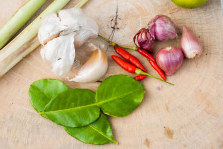 Herbs and spices set to make Tom Yum spicy soup on the chopping blockの写真素材