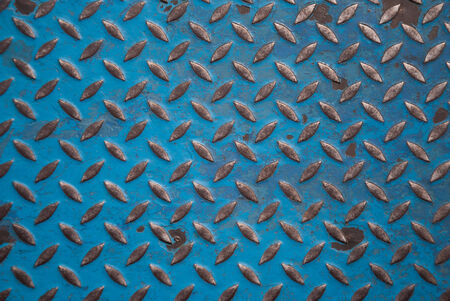 Background of a blue industrial metallic floor with a bumpy patternの写真素材