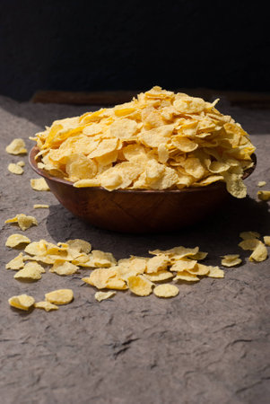 corn flakes in wooden bowl on a table