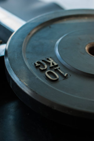 Barbell plates on the floor in the gym Ranong,Thailandの写真素材
