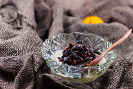 Thailand dessert sticky rice with black beans and coconut cream on Gray backgroundの写真素材