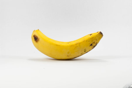 Ripe banana isolated on white background close upの写真素材