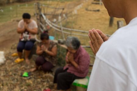 Give Food Offerings To a Buddhist Monk Of Thailand in morningの写真素材