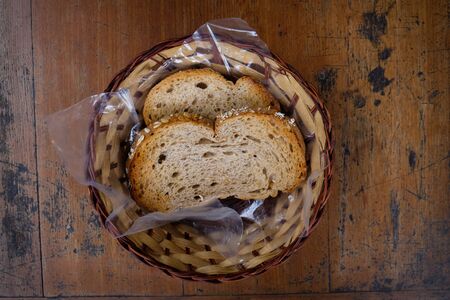 Whole Wheat Bread Slide in a Basket on wooden teble
