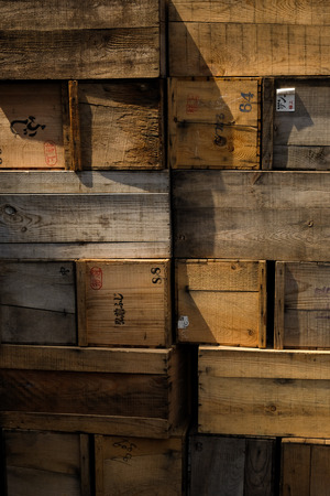 Grunge Crates stack. weathered wooden boxes background.