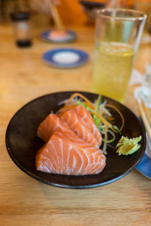 salmon Sashimi on Black Ceramic Plateclose upの写真素材