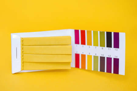 Universal litmus ph tester with color scale, yellow backgroundの写真素材