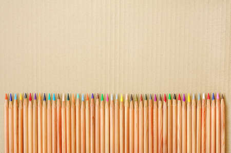 Colored pencils with blank space on craft cardboard, frame conceptの写真素材