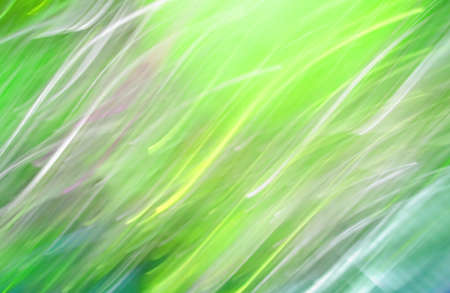 Green bright defocused lights garlands, abstract colored background