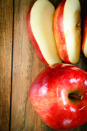 Red Apple on Woody Background. Studio Photo