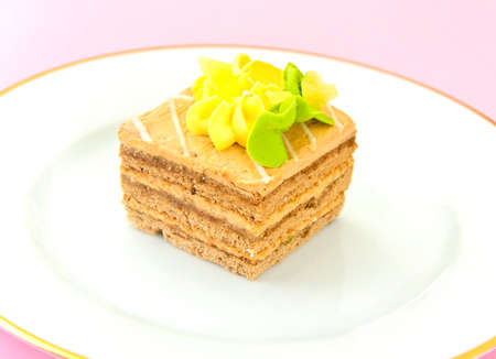 Sweets: Cream Cakes on Plate. Studio Photo