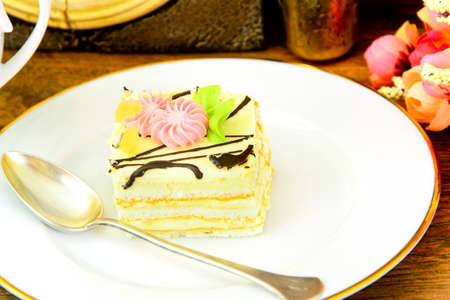 Sweets: Cream Cakes on Plate. Studio Photo