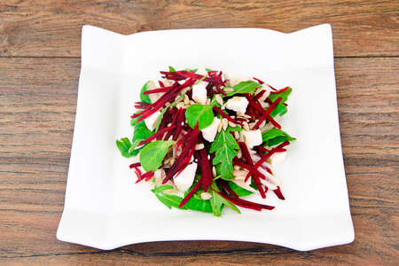 Salad of raw beets, pears, arugula, roots, sunflower seeds and cheese Studio Photoの写真素材