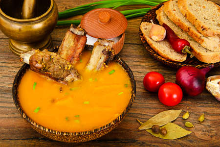 Diet and Healthy Organic Food: Pumpkin Soup with Pork Ribs. Studio Photoの写真素材