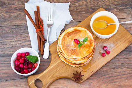 Tasty Pancakes with Cranberry and Honey Stack Studio Photoの写真素材
