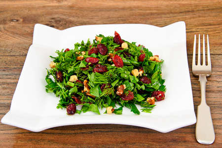 Salad with Dill, Parsley, Cilantro, Walnuts and Dried Cherries Studio Photoの写真素材