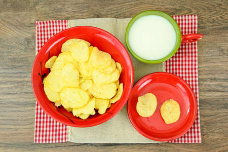 Potato Chips and Milk on Wood. Studio Photo