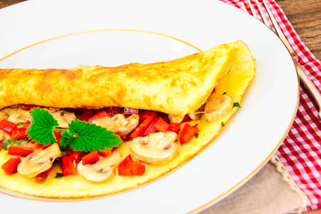 Healthy and Diet Food: Scrambled Eggs with Mushrooms and Vegetables. Studio Photoの写真素材