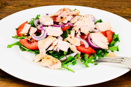 Salad with Arugula, Tomatoes, Turkey Breast, Grape Seed Oil, Soy Sauce Studio Photoの写真素材
