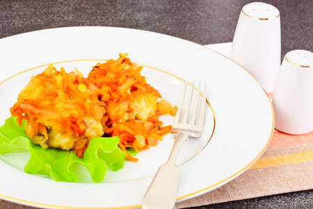 Fish in Greek with Onion and Carrot Studio Photo