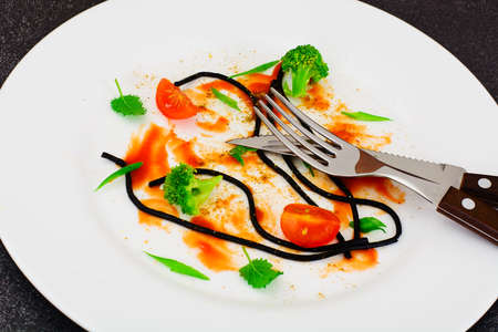 Dirty Dishes. Remains Smeared Sauce and Spaghetti Studio Photo
