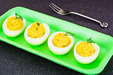 Stuffed Eggs with Pomegranate on Plate Studio Photoの写真素材