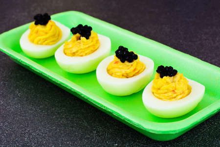 Stuffed Eggs with Pomegranate on Plate Studio Photoの写真素材