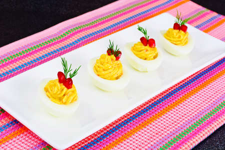 Stuffed Eggs with Pomegranate on Plate Studio Photoの写真素材