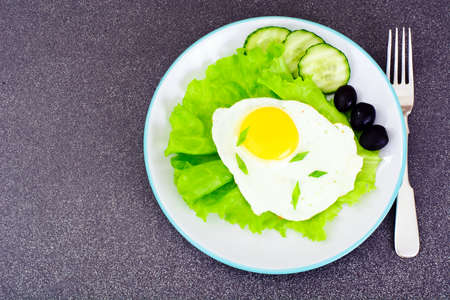 Scrambled Eggs with Chia Seeds, Lettuce and Cucumber Studio Photoの写真素材