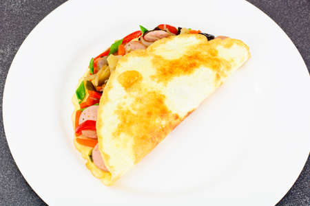 Healthy and Diet Food: Scrambled Eggs with Sausage and Vegetables. Studio Photoの写真素材